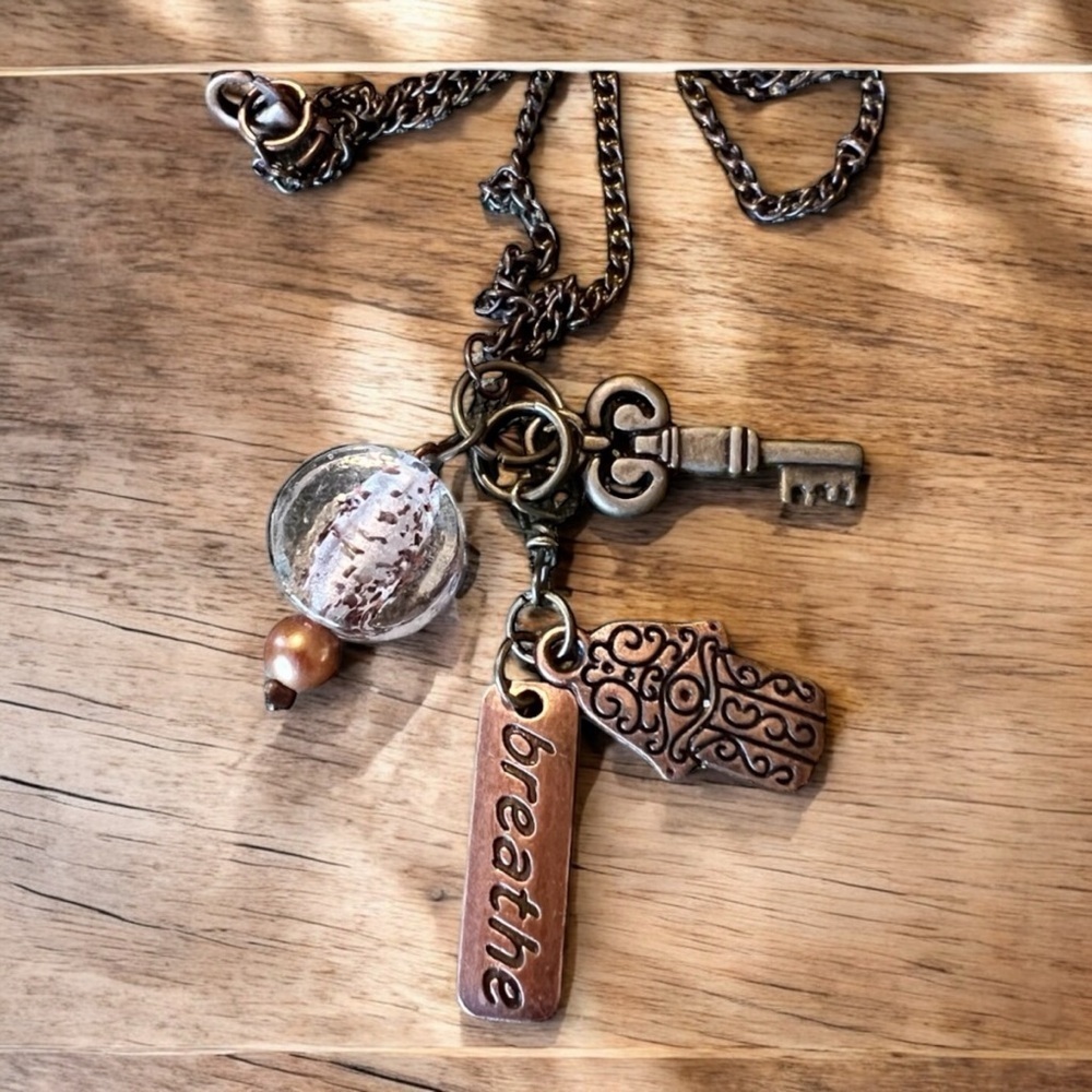 Unique bronze necklace key and charm details clear glass bead and 'breathe' tag. - Picture 7 of 15